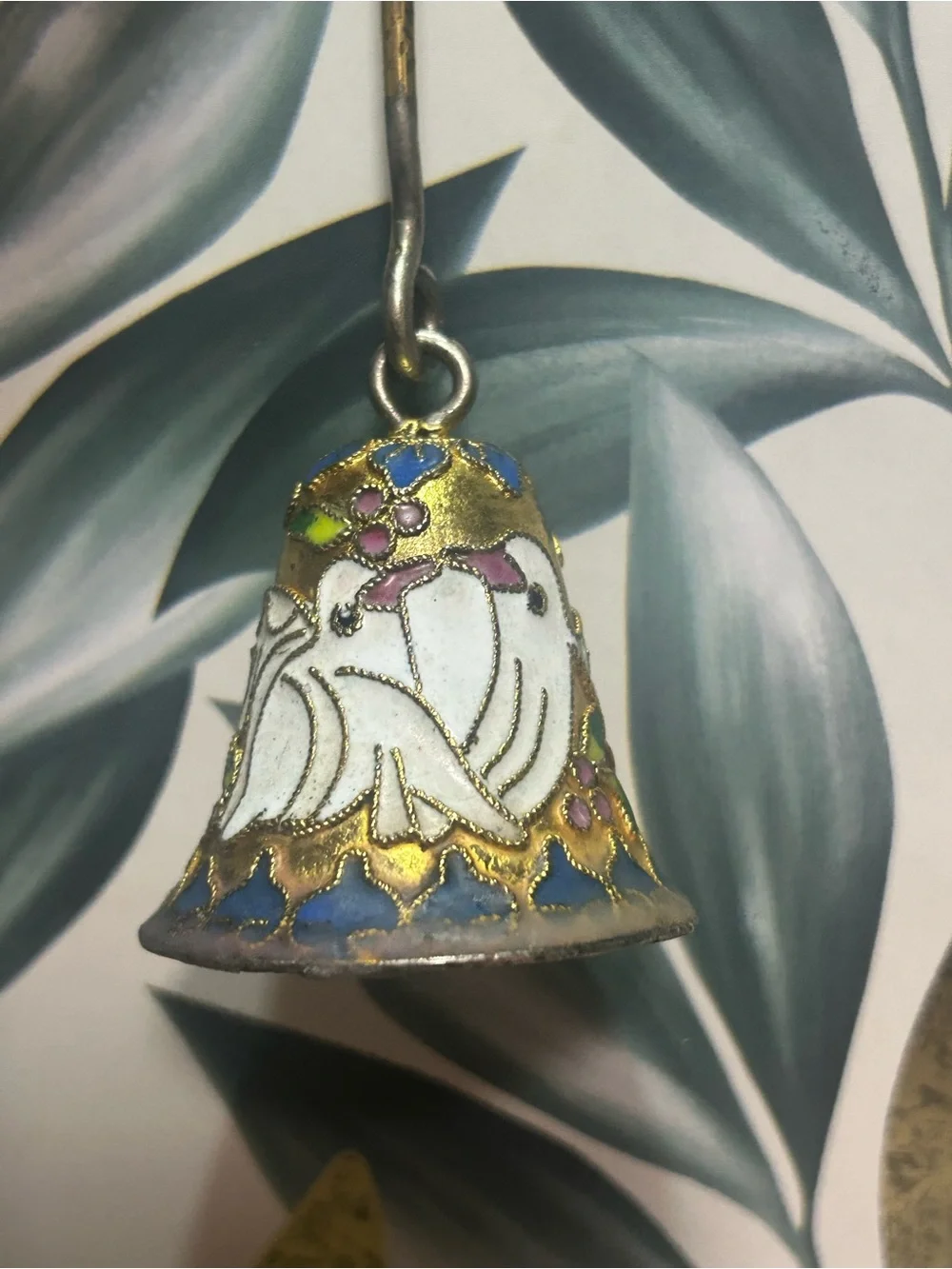 This is a Vintage Cloisonné Enamel Candle Snuffer.